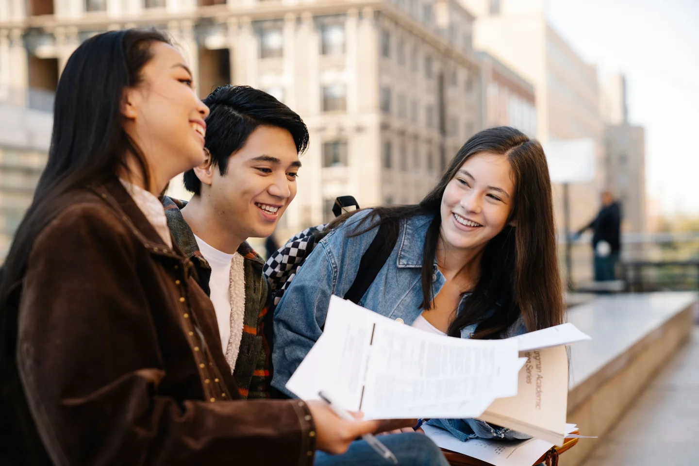 University students sharing ideas outdoors
